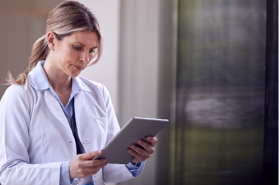 A lady doctor busy with ser device